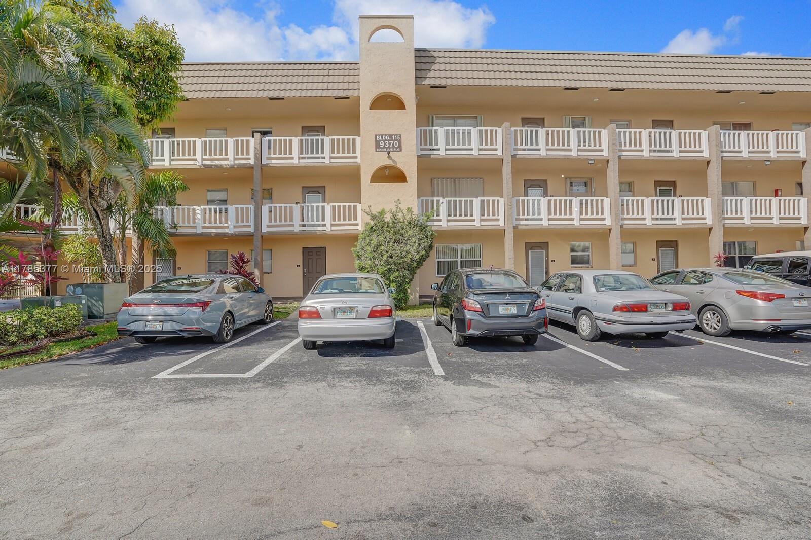 9370 Sunrise Lakes Boulevard, Unit 105 Sunrise, FL 33322 - Photo 1 of 14 a car parked in front of a building