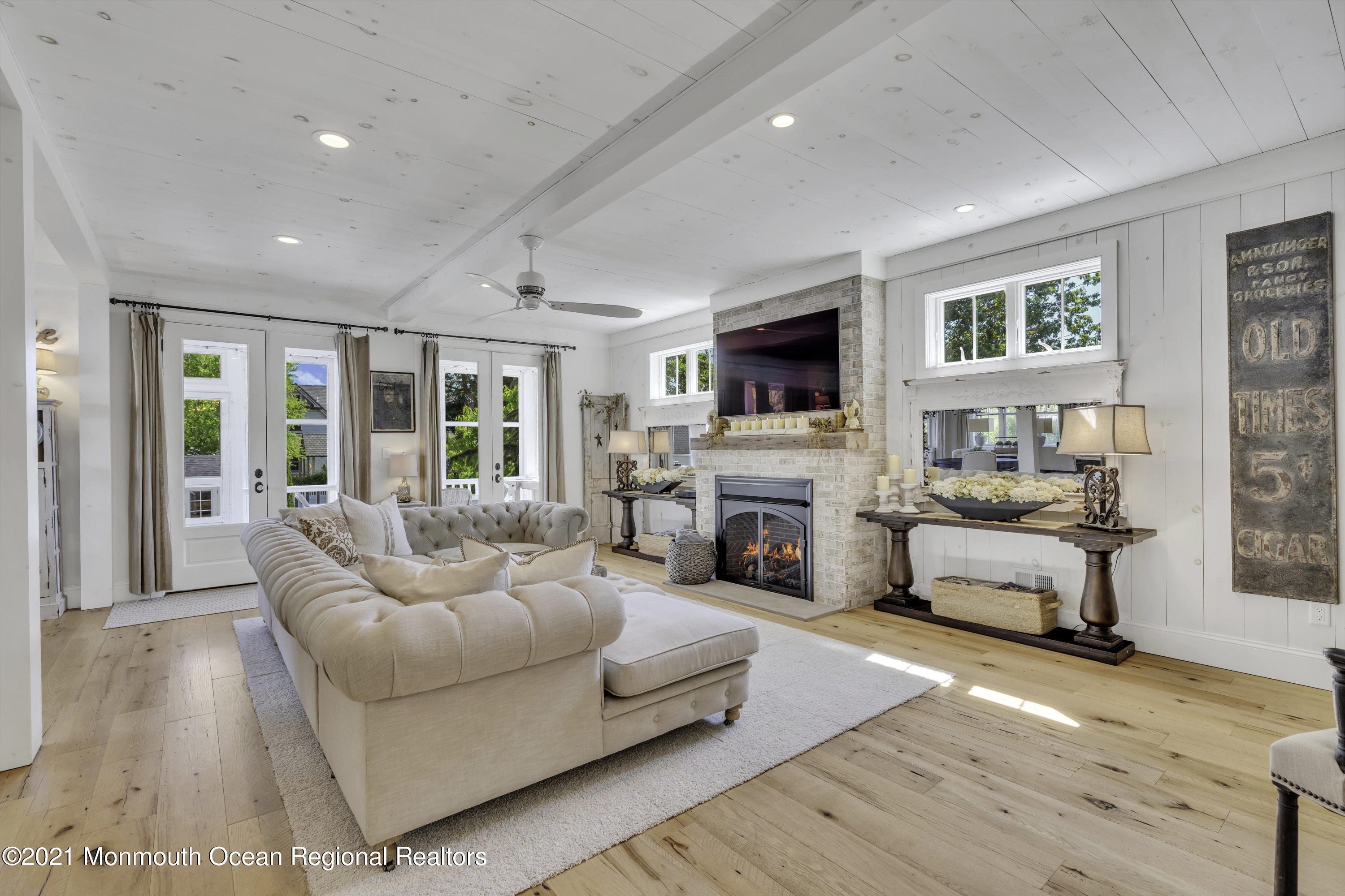 52 Marcellus Avenue Manasquan, NJ 08736 - Photo 18 of 79 a spacious bedroom with a large bed and a couch