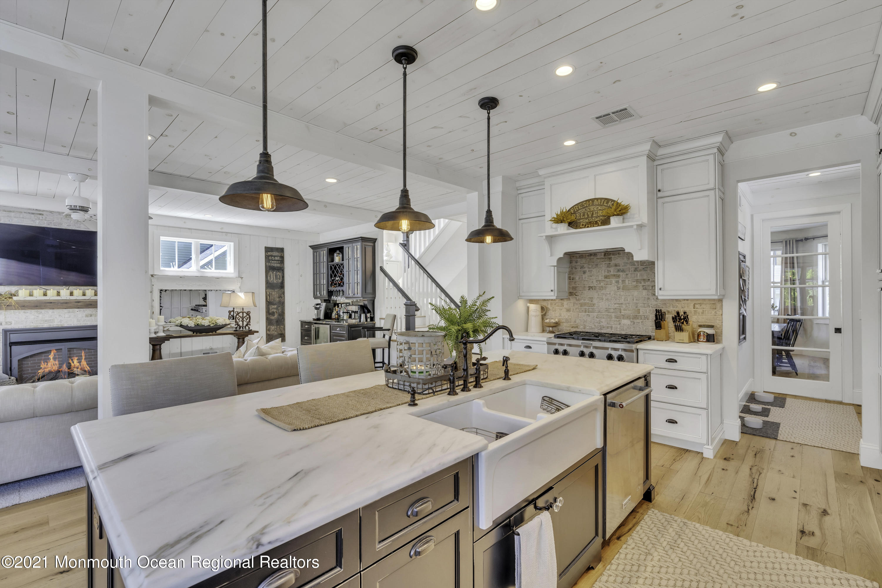 52 Marcellus Avenue Manasquan, NJ 08736 - Photo 22 of 79 a kitchen with stainless steel appliances granite countertop a sink a stove and a wooden floor