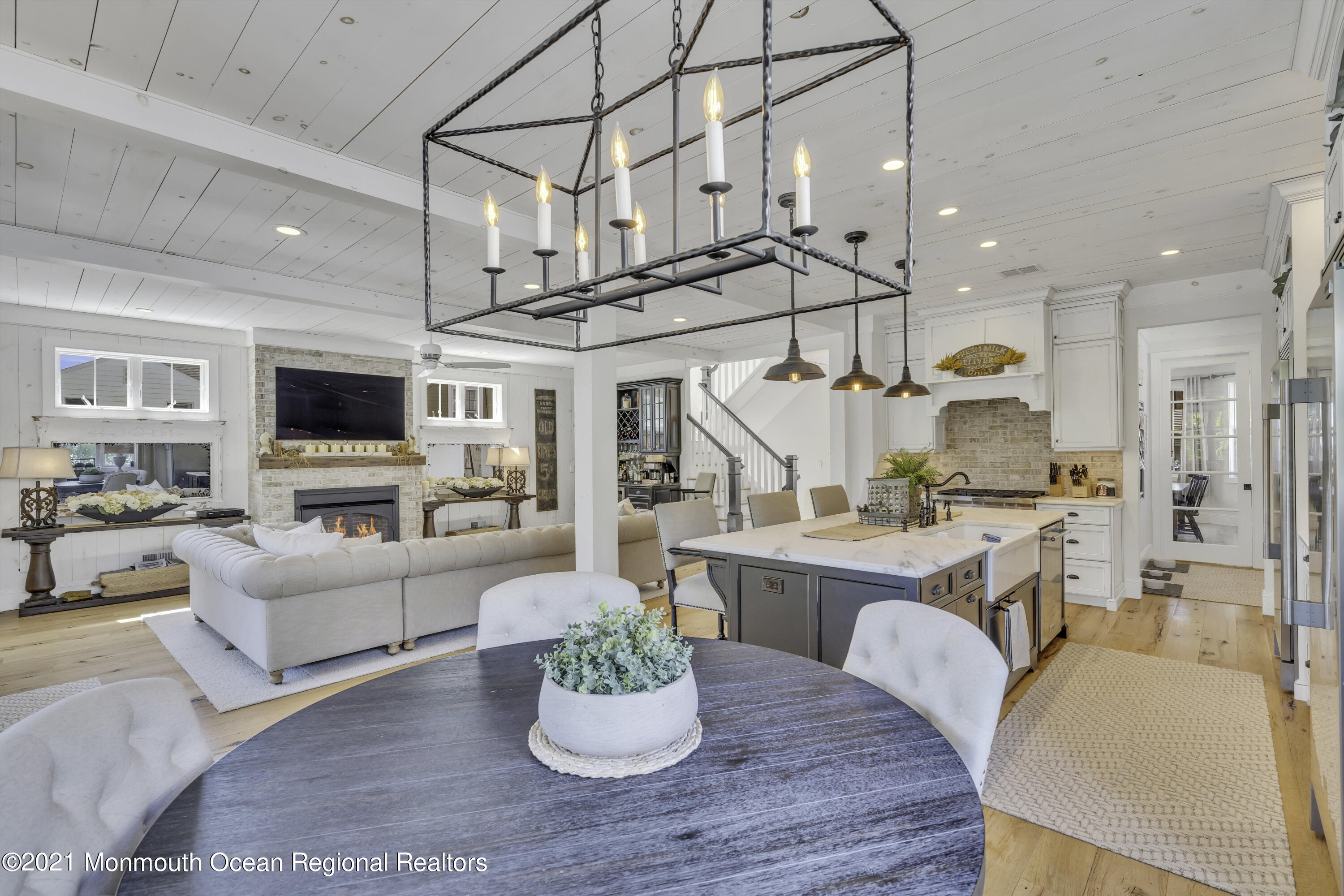 52 Marcellus Avenue Manasquan, NJ 08736 - Photo 27 of 79 a living room with furniture kitchen view and a wooden floor