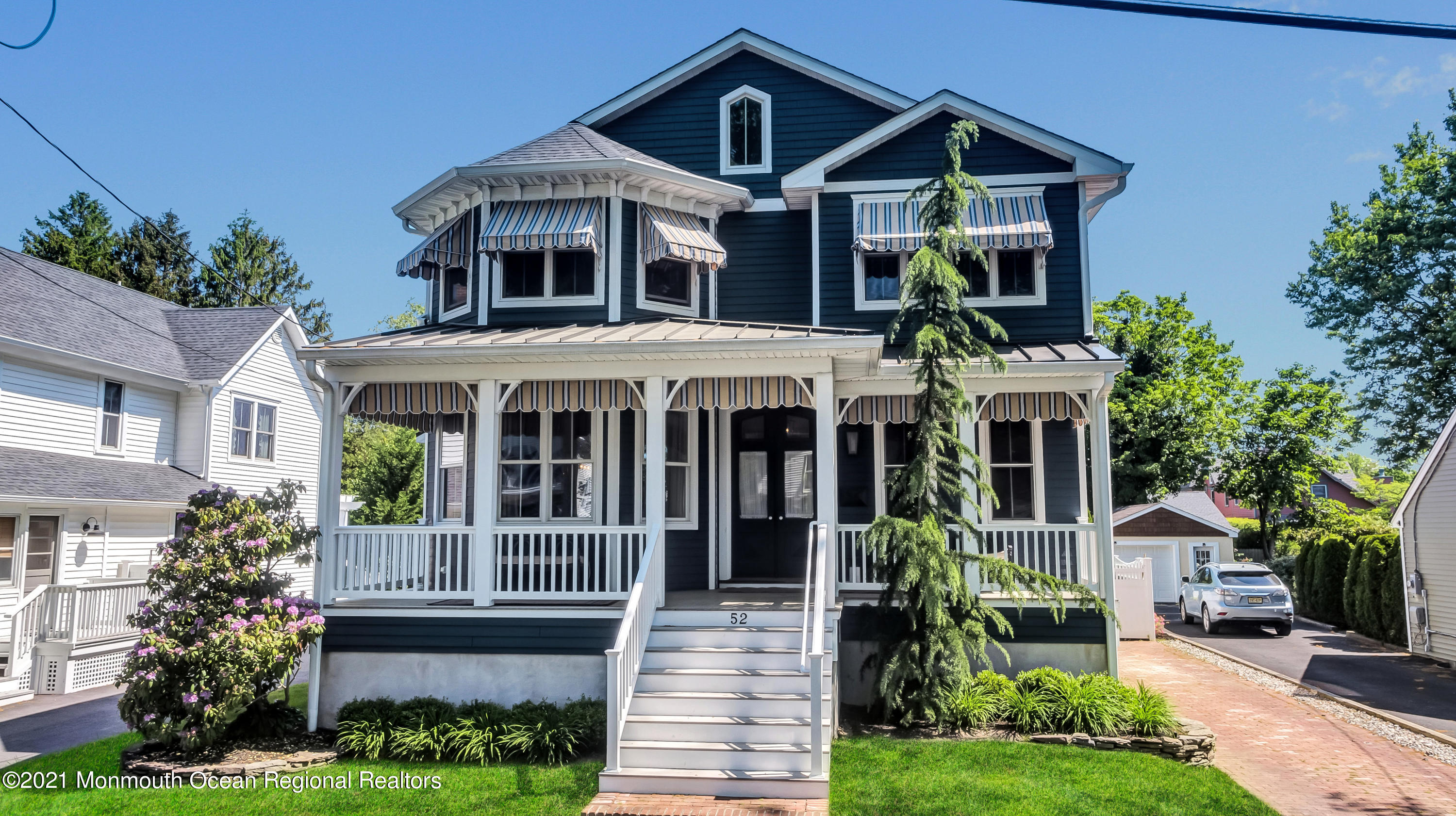52 Marcellus Avenue Manasquan, NJ 08736 - Photo 33 of 79 a front view of a house with a yard