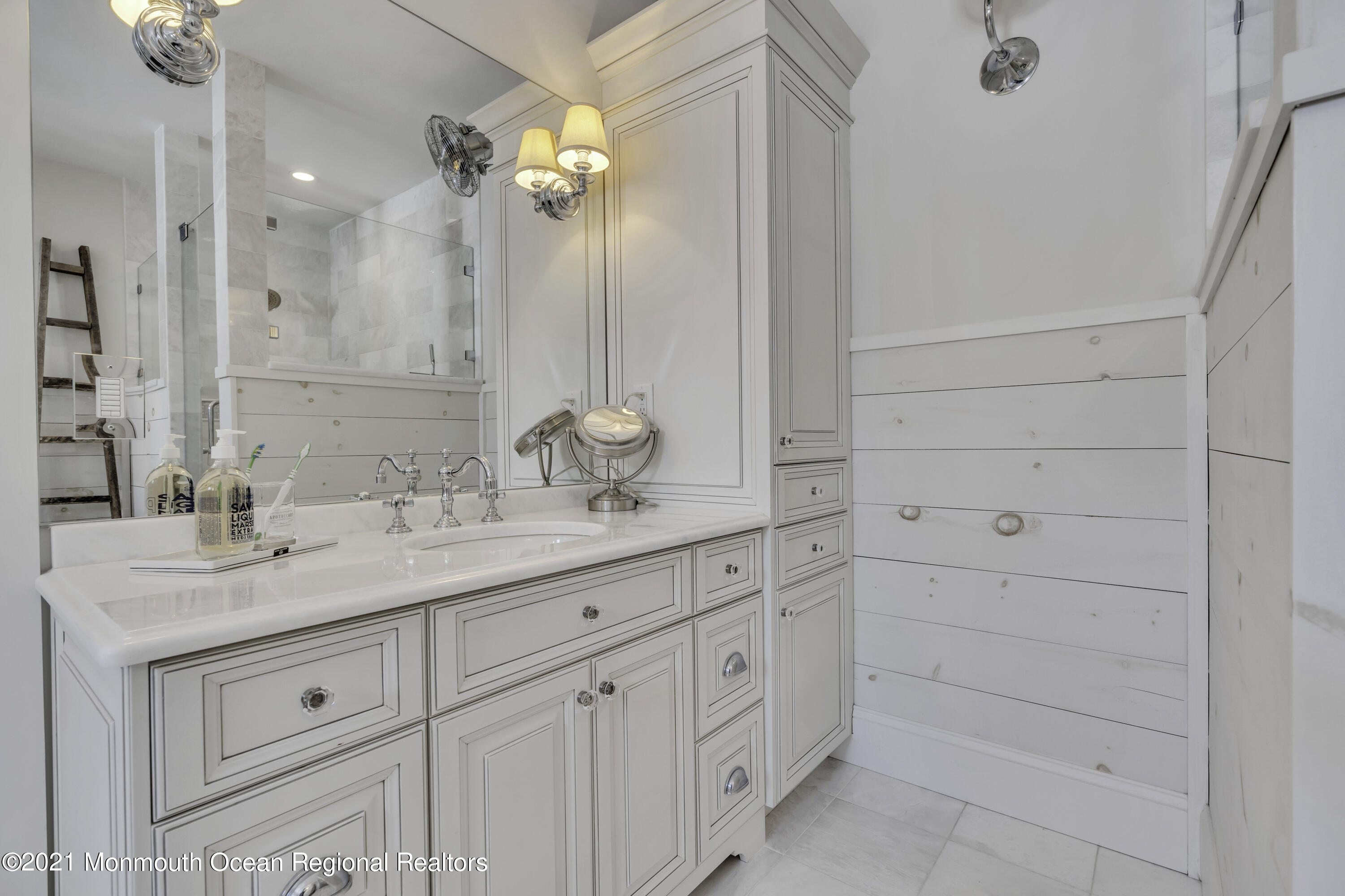 52 Marcellus Avenue Manasquan, NJ 08736 - Photo 61 of 79 a bathroom with a sink and a mirror