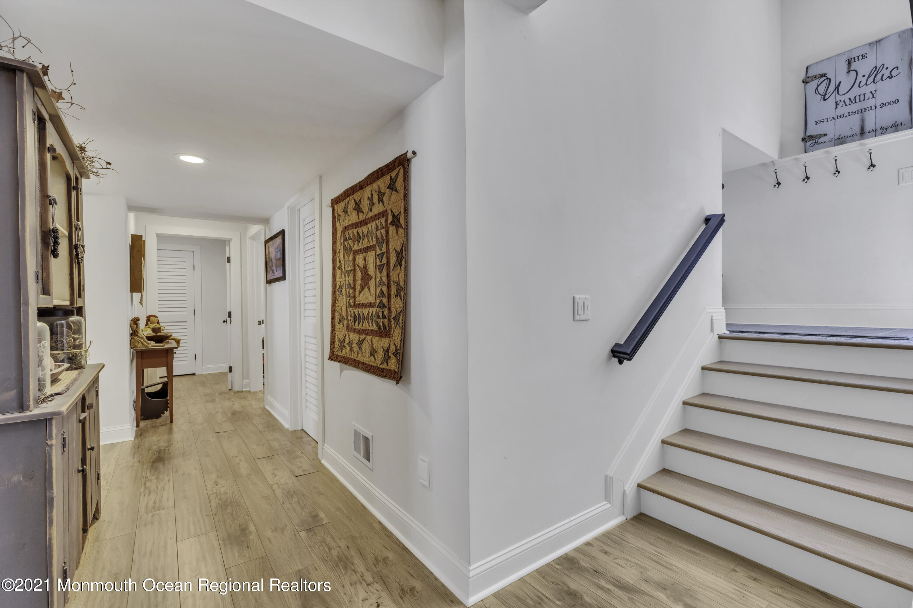 52 Marcellus Avenue Manasquan, NJ 08736 - Photo 64 of 79 a view of entryway with furniture and wooden floor