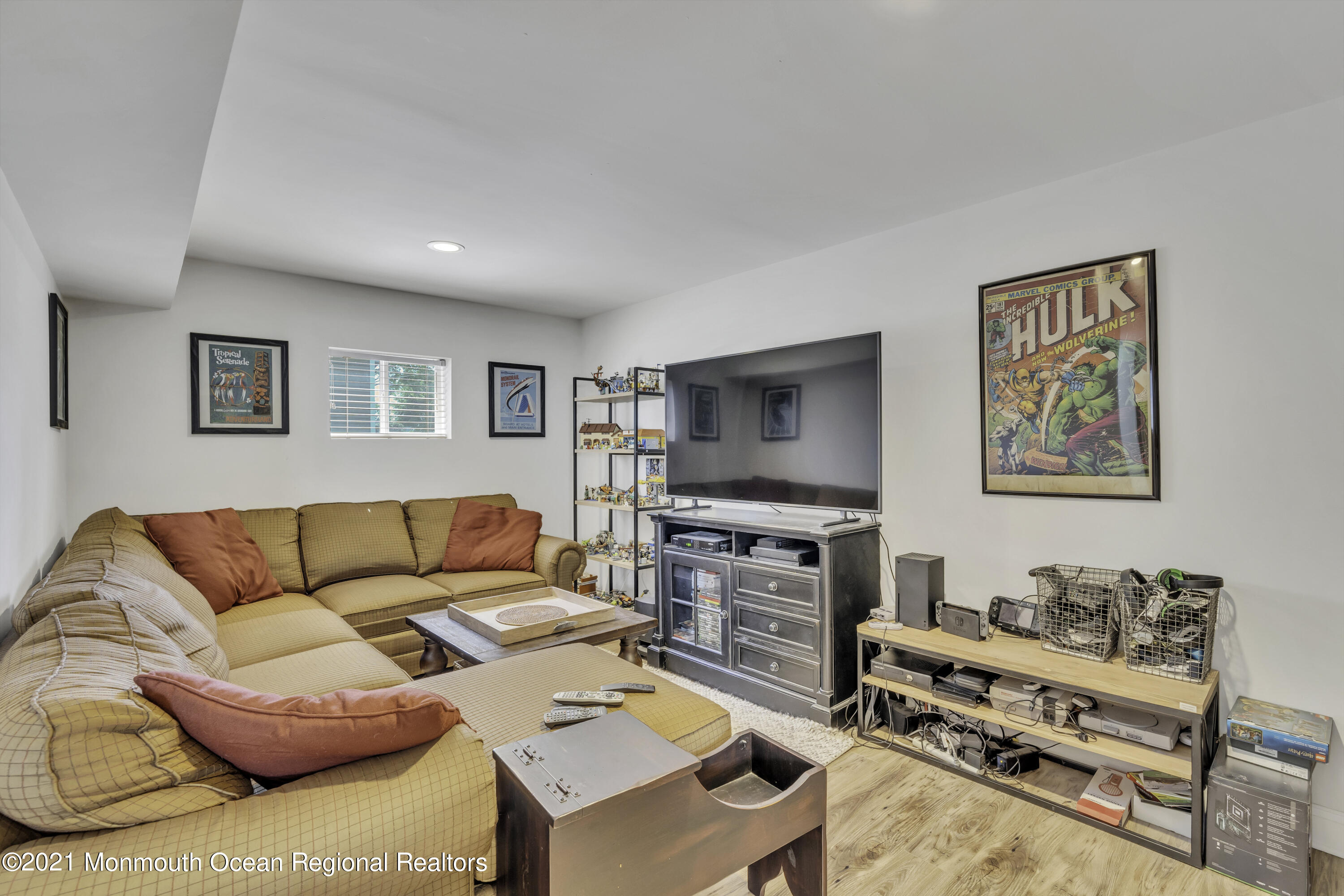 52 Marcellus Avenue Manasquan, NJ 08736 - Photo 65 of 79 a living room with furniture and a flat screen tv