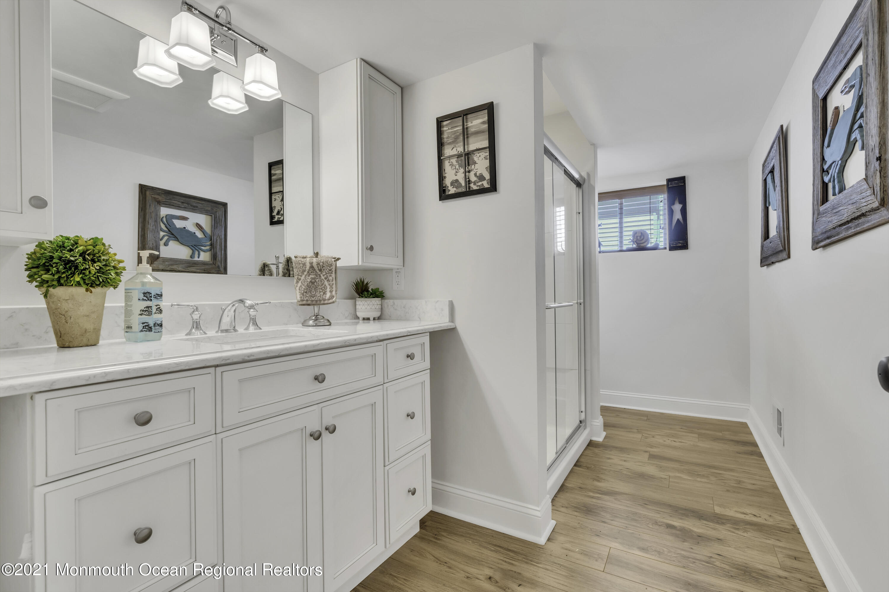 52 Marcellus Avenue Manasquan, NJ 08736 - Photo 68 of 79 a bathroom with a sink and a mirror