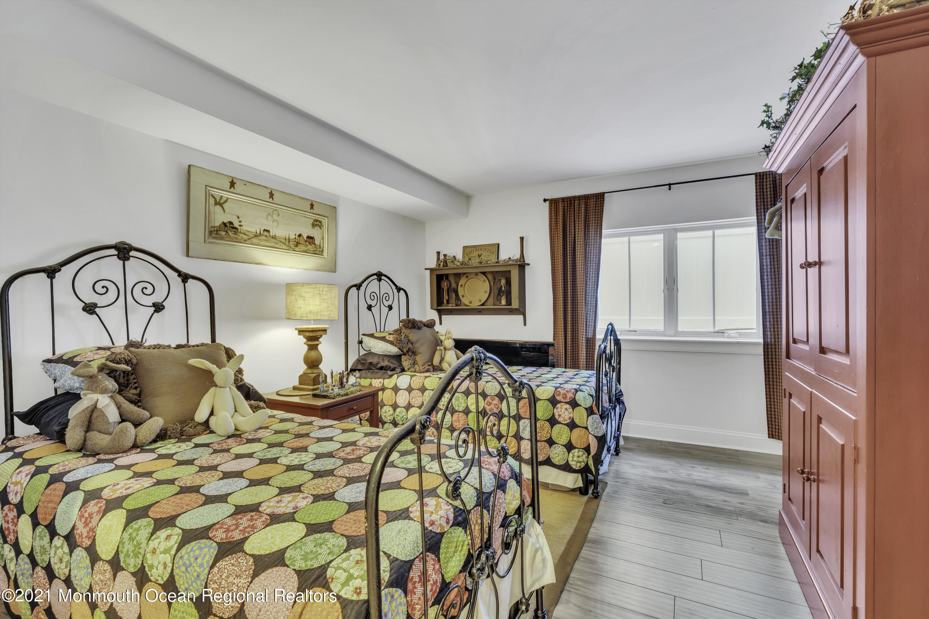 52 Marcellus Avenue Manasquan, NJ 08736 - Photo 70 of 79 a bedroom with a bed and glass windows