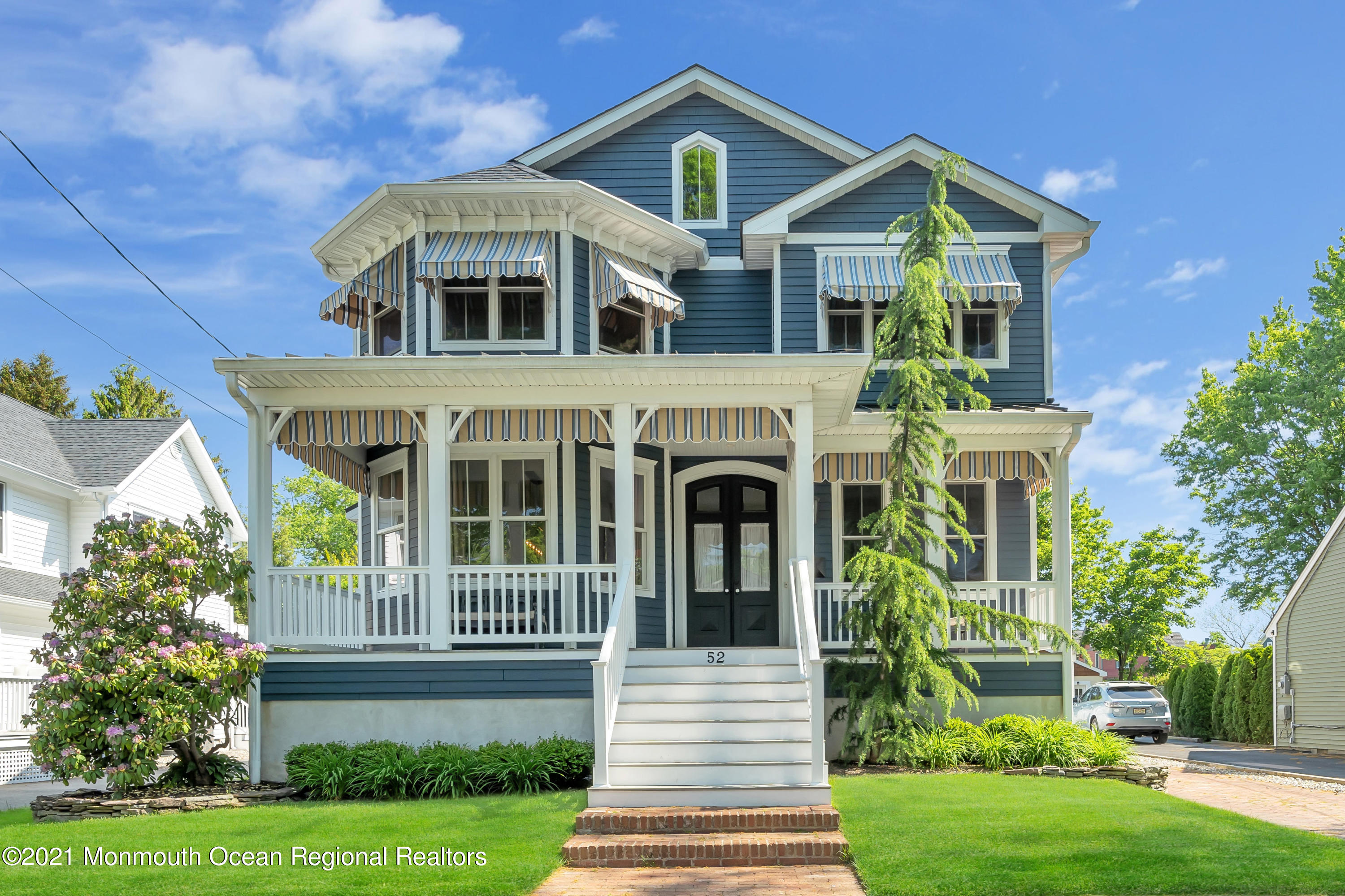 52 Marcellus Avenue Manasquan, NJ 08736 - Photo 74 of 79 a front view of a house with a yard