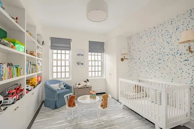 a bedroom with furniture and a book shelf