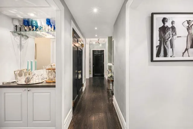 a kitchen with kitchen island sink stove and refrigerator