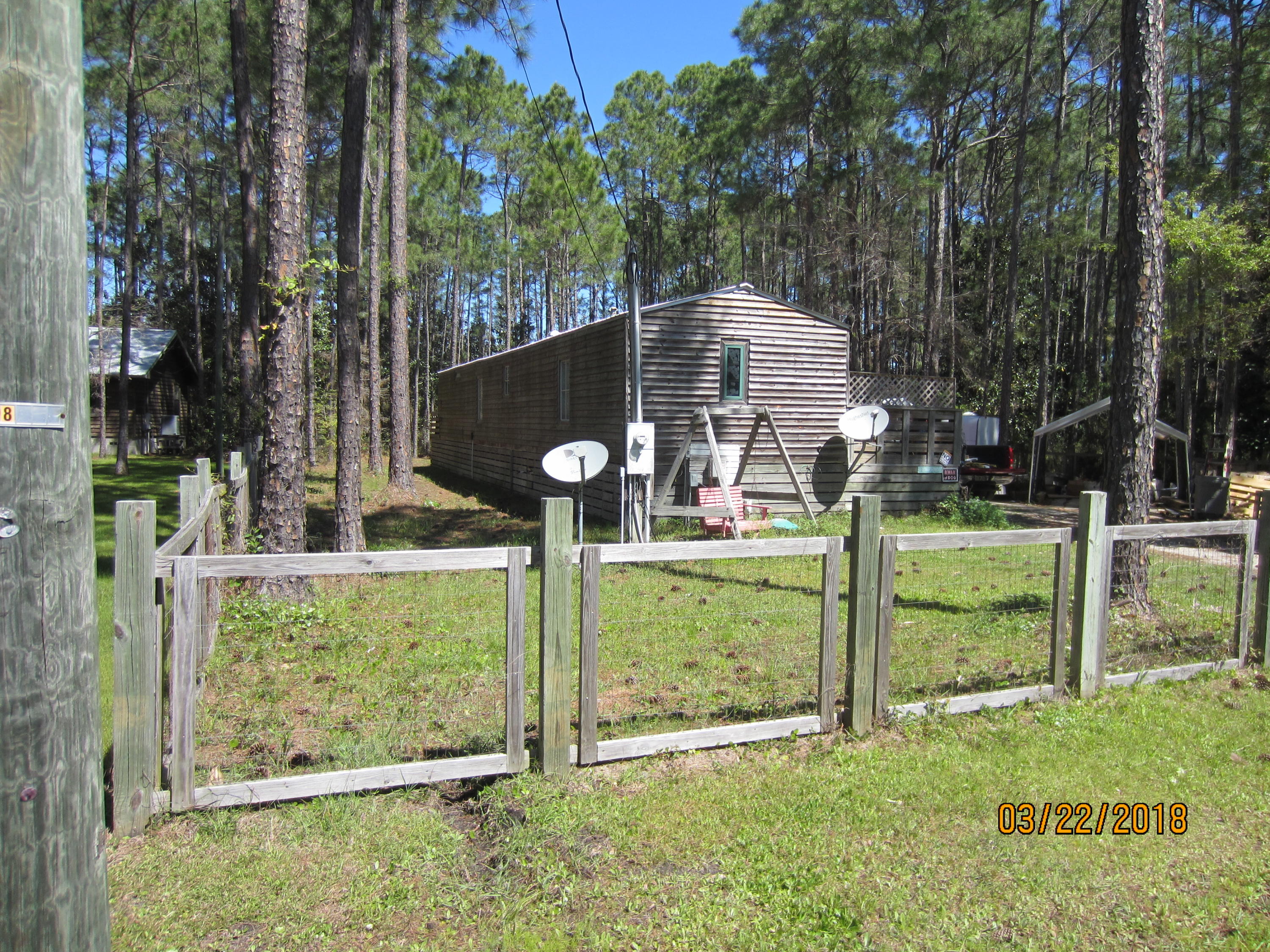 89 East Nursery Road Santa Rosa Beach, FL 32459 - Photo 1 of 8 front view of a house with a yard