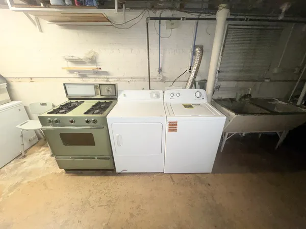 a kitchen with a stove and a refrigerator