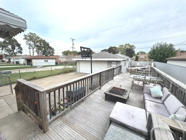a view of a house with pool and chairs