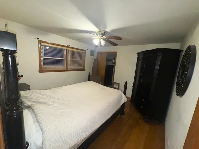 a bedroom with a bed and a walk in closet