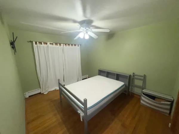 a room with a bed and a chandelier
