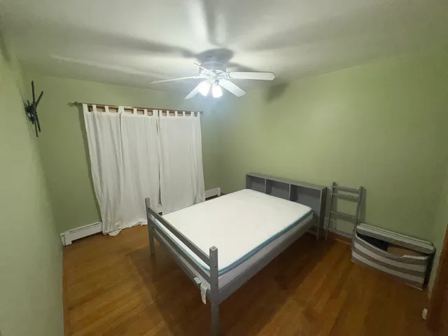 a room with a bed and a chandelier