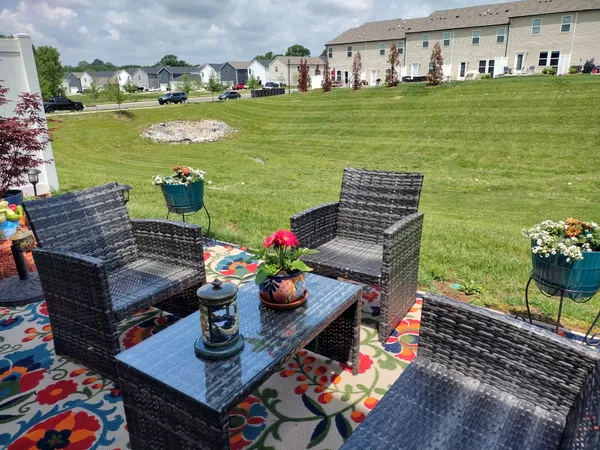a view of a chairs and table in patio