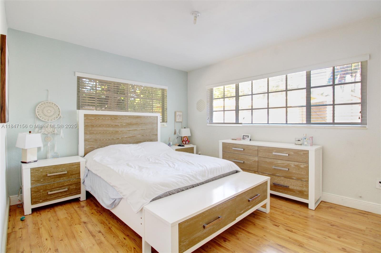 9755 Southwest 161st Street Miami, FL 33157 - Photo 15 of 32 a bedroom with a bed and a dresser