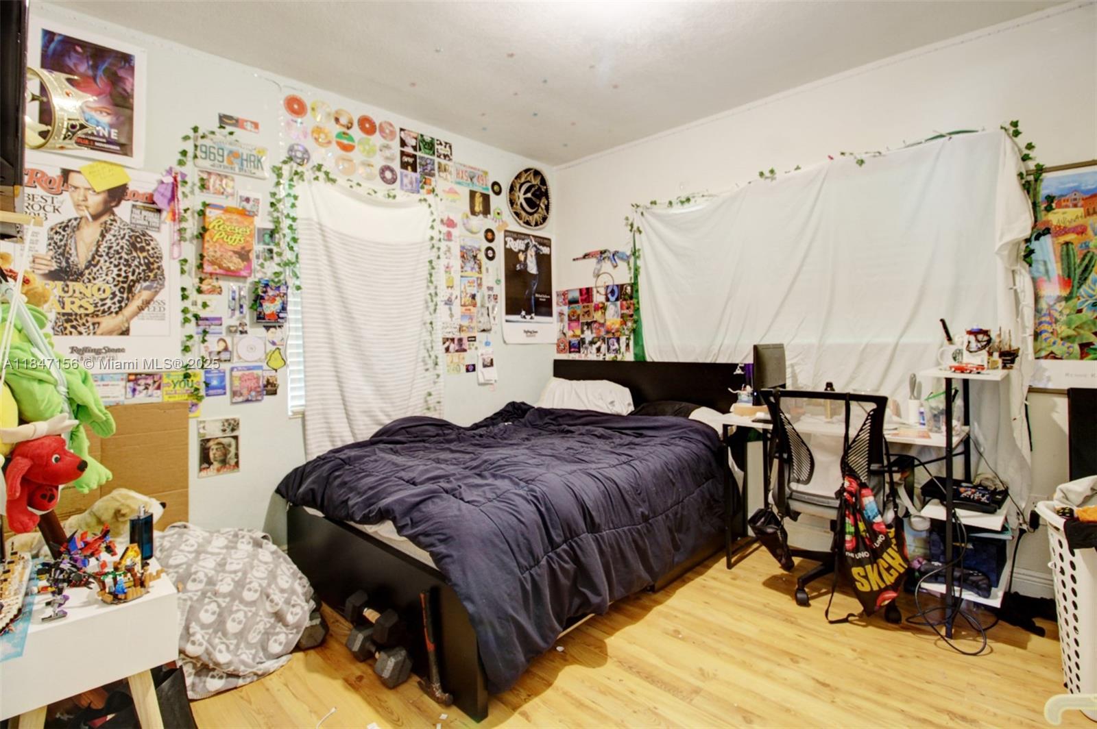 9755 Southwest 161st Street Miami, FL 33157 - Photo 17 of 32 a bedroom with a bed and a couch