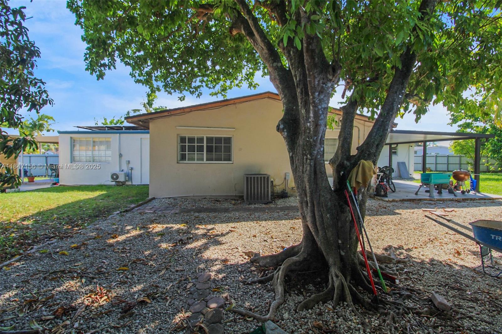 9755 Southwest 161st Street Miami, FL 33157 - Photo 24 of 32 a view of a house with a yard