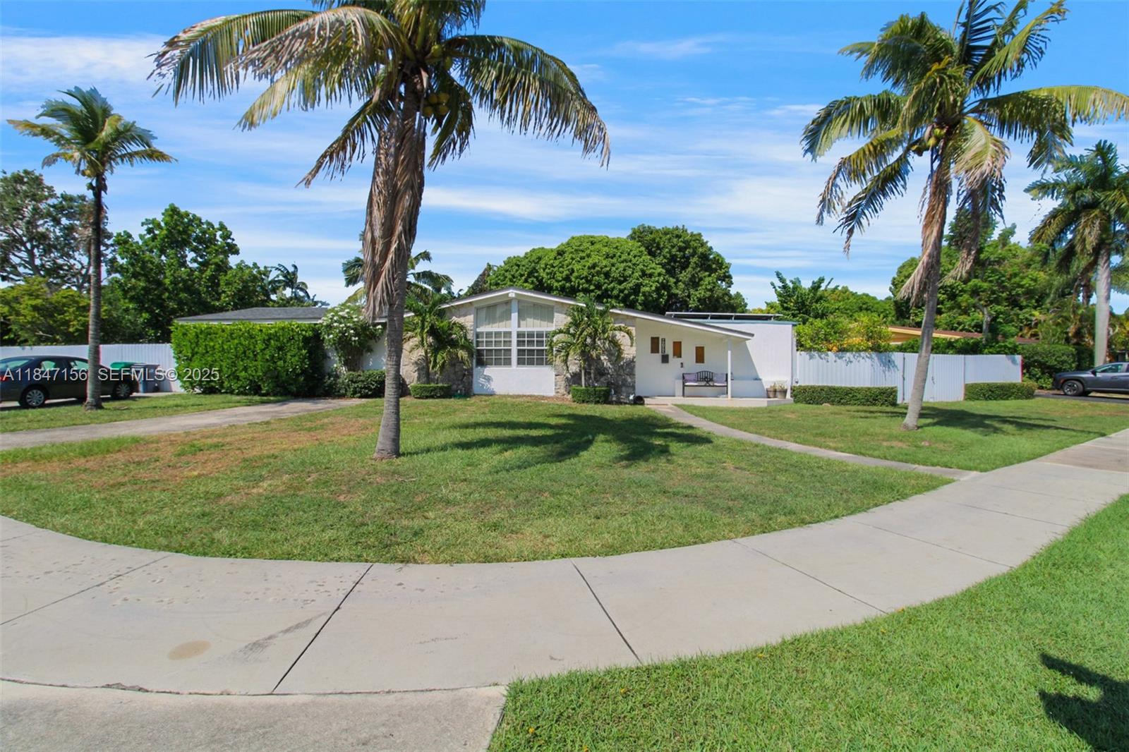 9755 Southwest 161st Street Miami, FL 33157 - Photo 4 of 32 a view of a backyard with palm trees