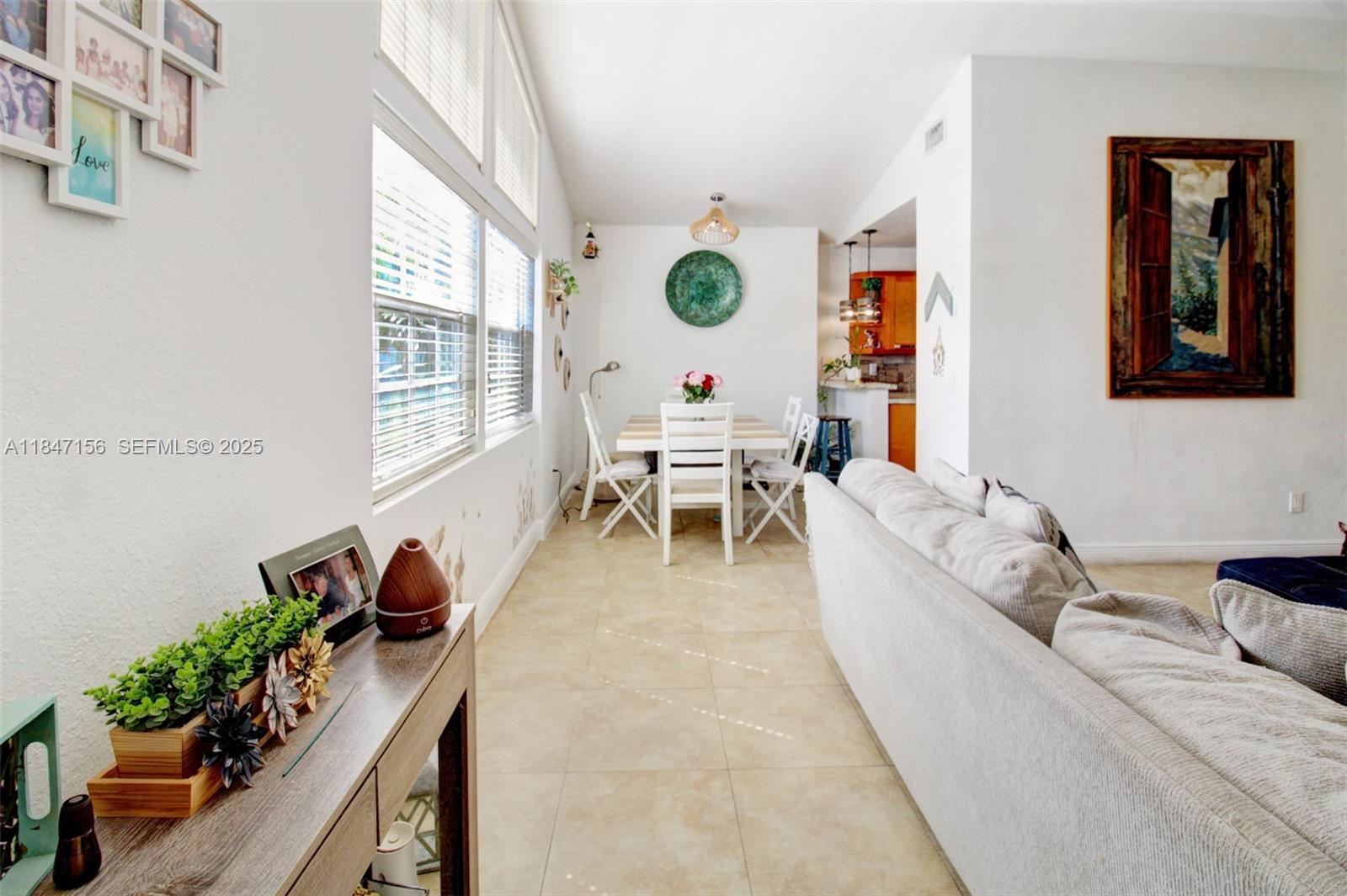 9755 Southwest 161st Street Miami, FL 33157 - Photo 5 of 32 a living room with furniture and a large window