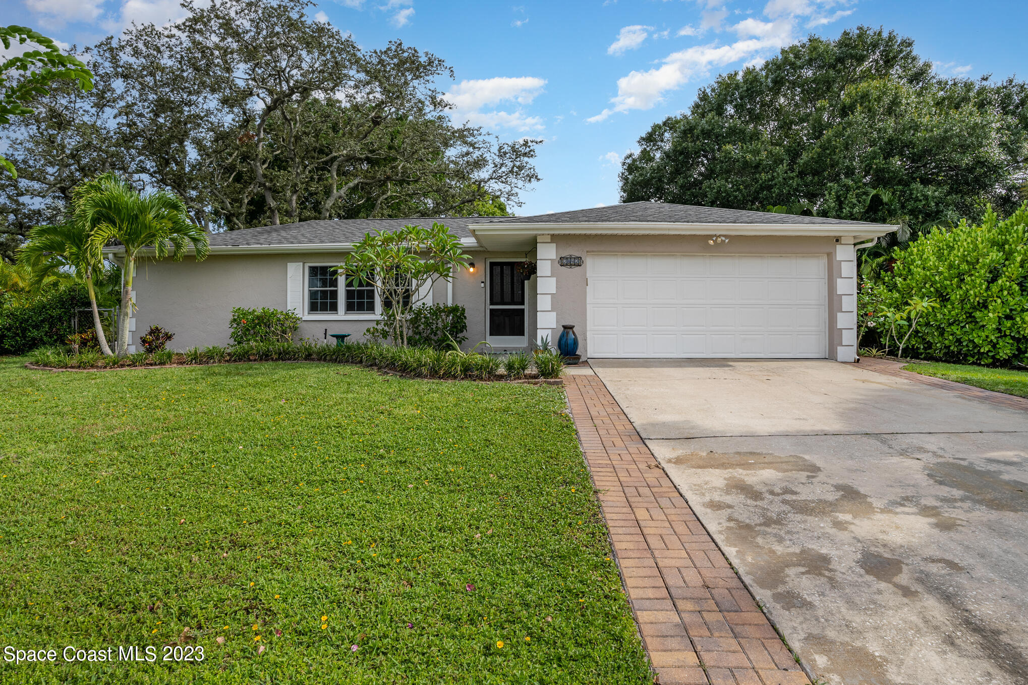 2842 Watkins Drive Melbourne, FL 32901 - Photo 1 of 39 front view of a house with a yard