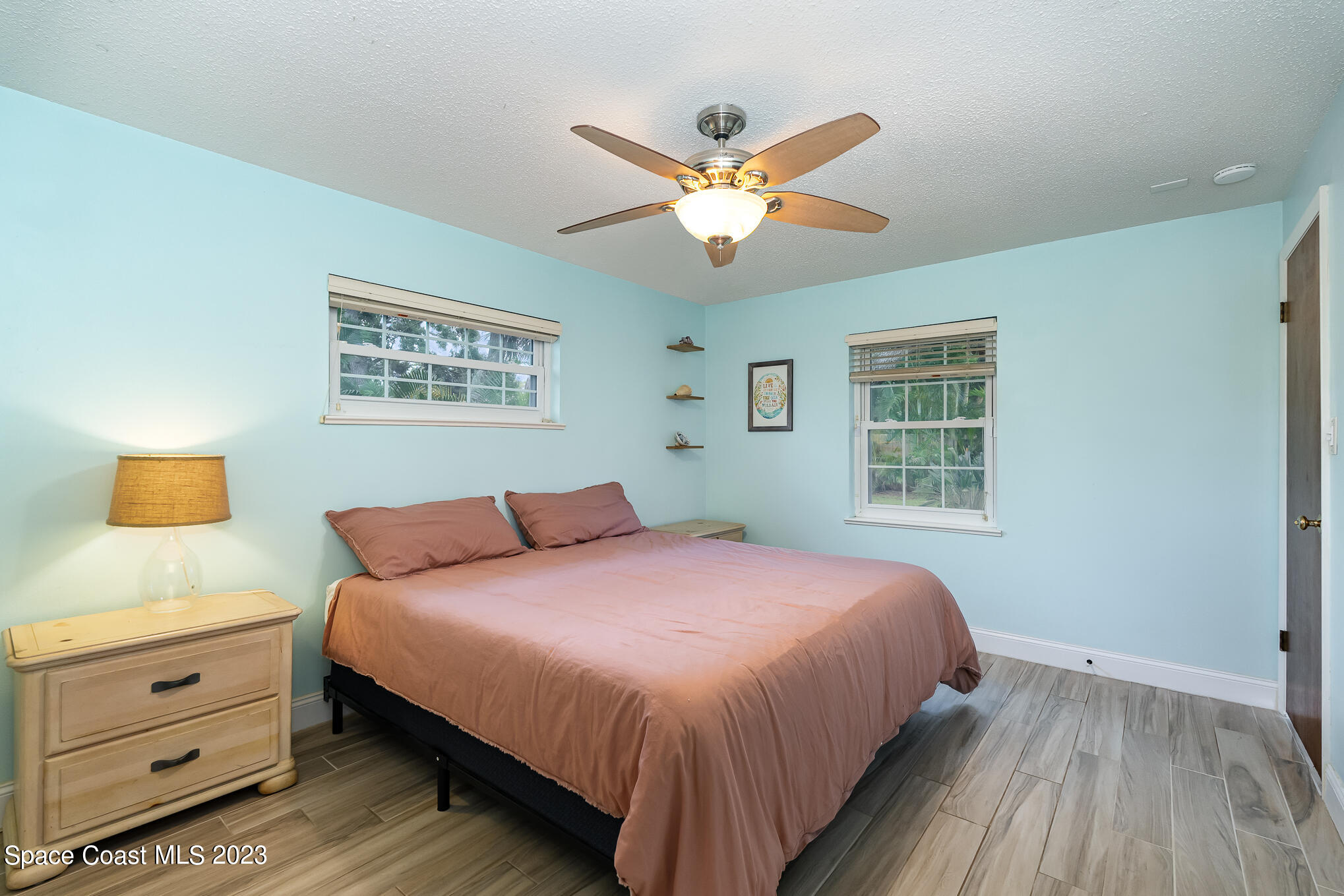 2842 Watkins Drive Melbourne, FL 32901 - Photo 14 of 39 a bedroom with a bed and a window