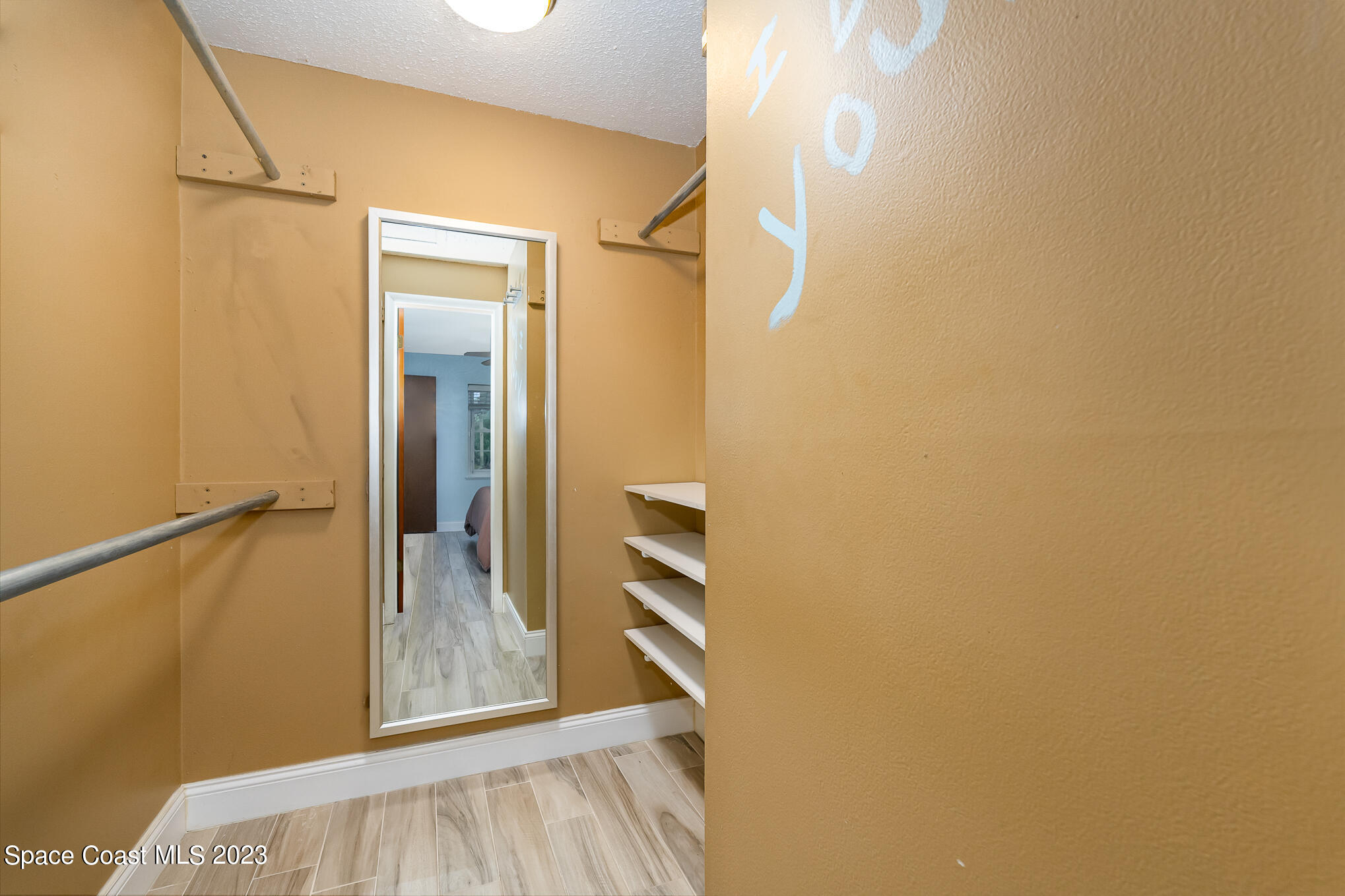 2842 Watkins Drive Melbourne, FL 32901 - Photo 16 of 39 a view of walk in closet with empty racks