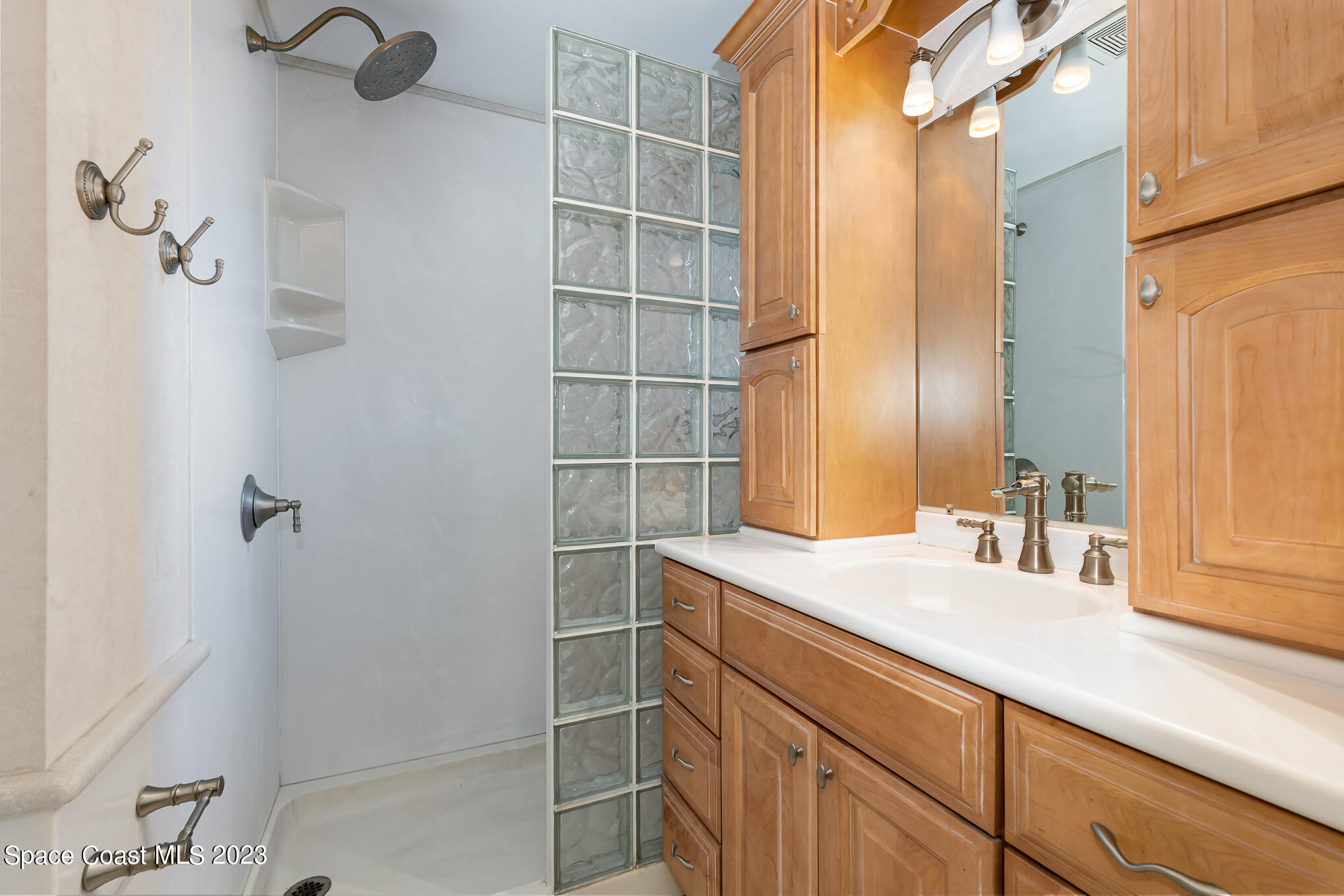 2842 Watkins Drive Melbourne, FL 32901 - Photo 17 of 39 a bathroom with a sink and a mirror