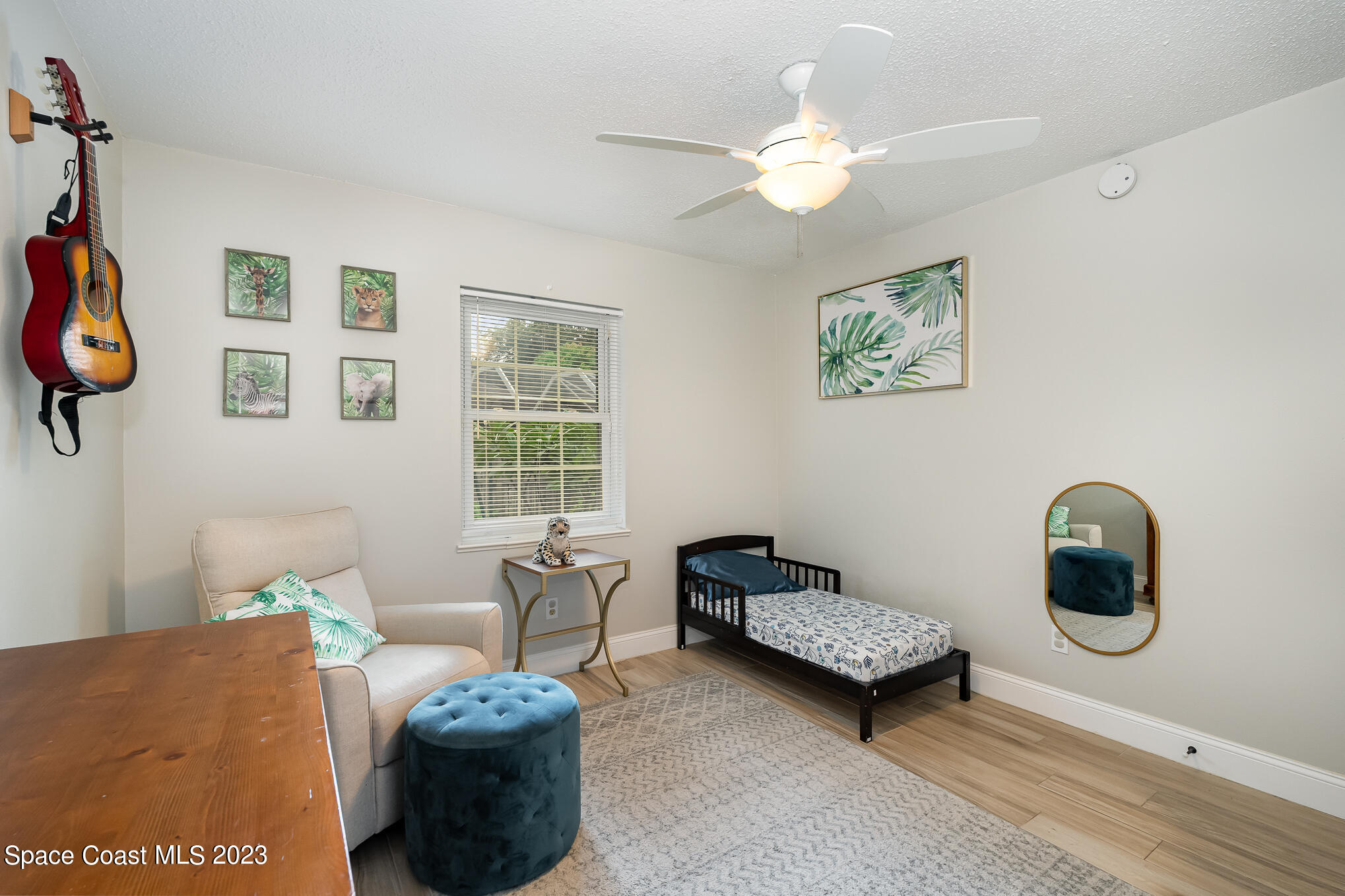 2842 Watkins Drive Melbourne, FL 32901 - Photo 21 of 39 a living room with furniture and a large window