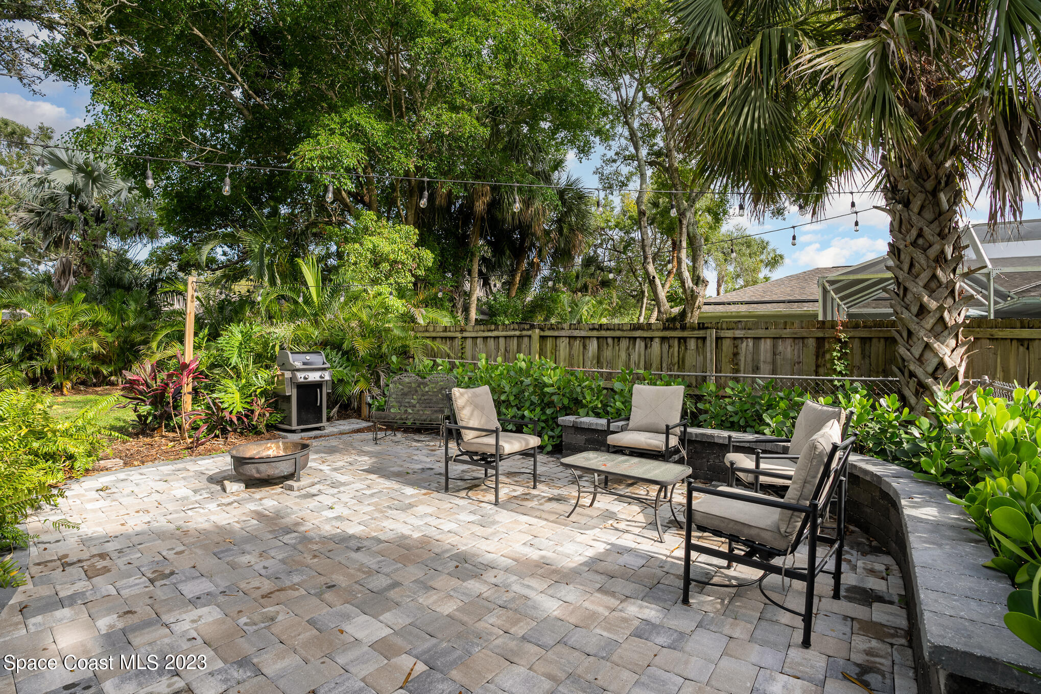 2842 Watkins Drive Melbourne, FL 32901 - Photo 27 of 39 a view of a patio with chairs and potted plants