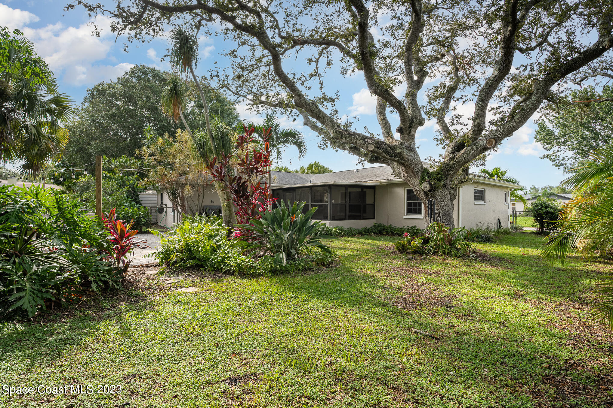 2842 Watkins Drive Melbourne, FL 32901 - Photo 30 of 39 a view of a house with a yard
