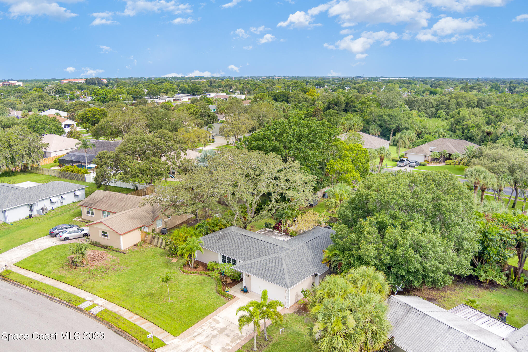 2842 Watkins Drive Melbourne, FL 32901 - Photo 33 of 39 an aerial view of residential houses with outdoor space and trees