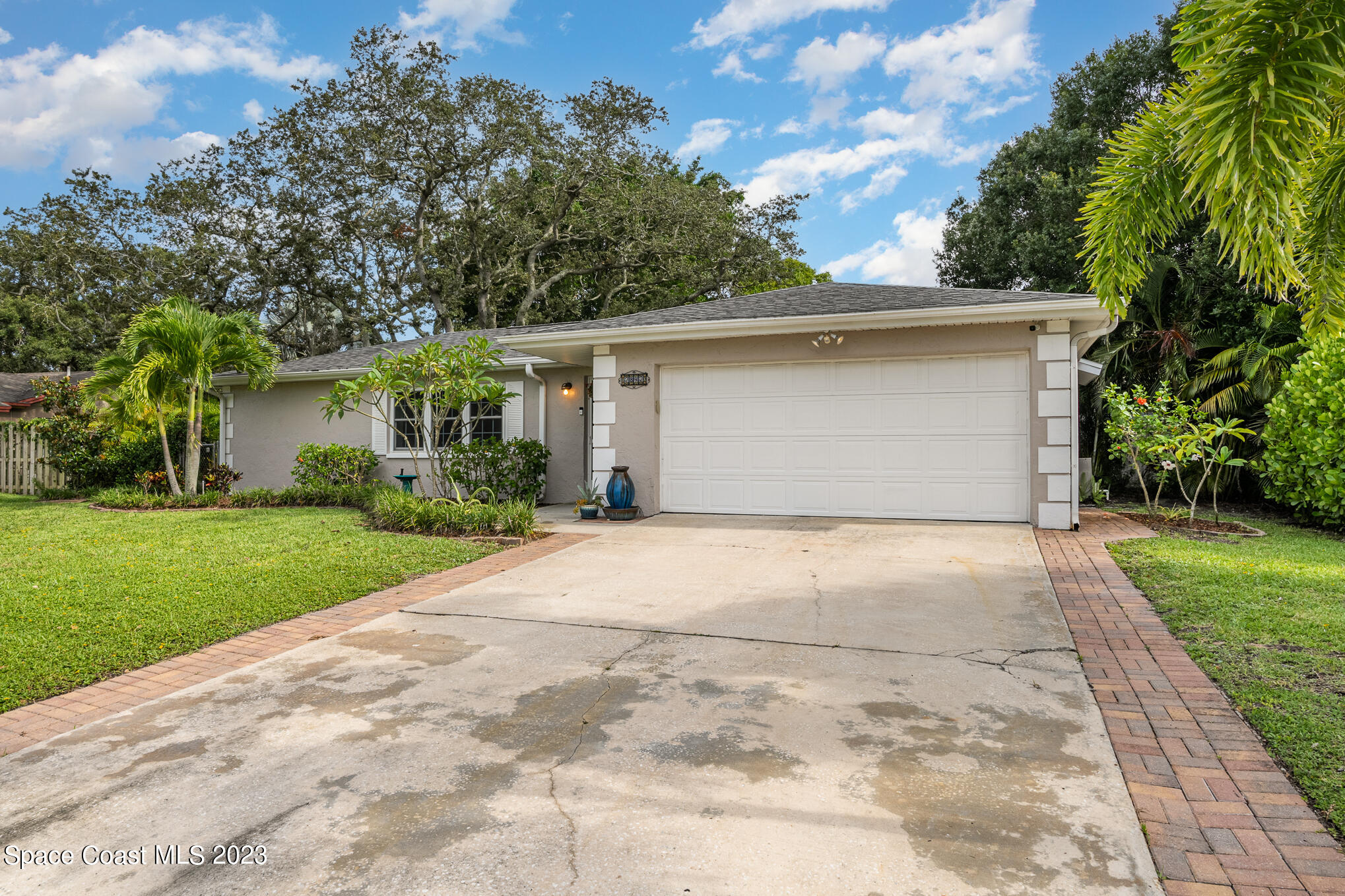 2842 Watkins Drive Melbourne, FL 32901 - Photo 38 of 39 a front view of house with yard and trees