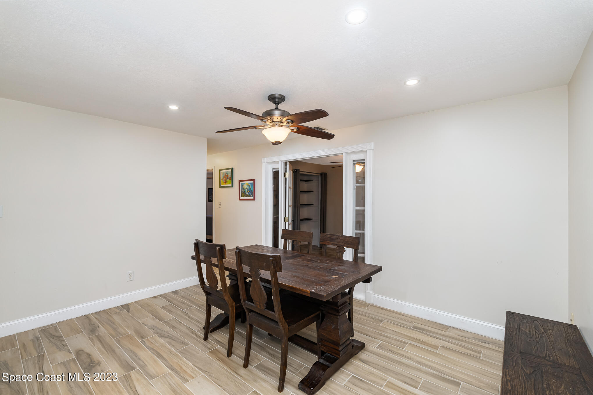 2842 Watkins Drive Melbourne, FL 32901 - Photo 8 of 39 a view of a dining room with furniture and wooden floor