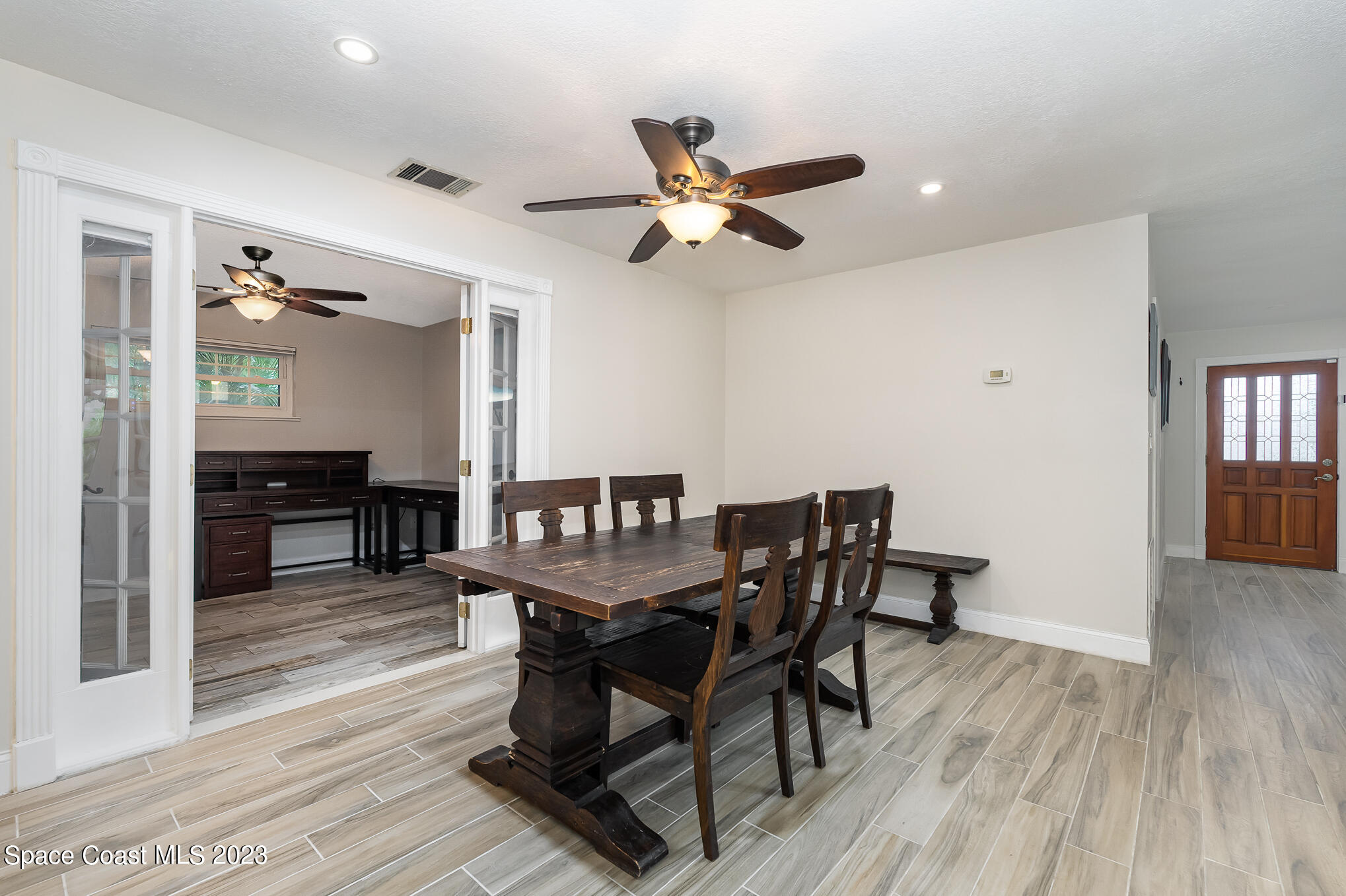 2842 Watkins Drive Melbourne, FL 32901 - Photo 10 of 39 a view of a dining room with furniture and wooden floor