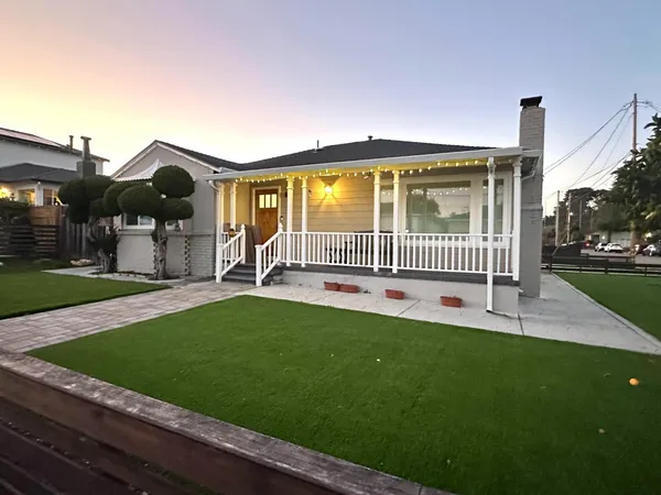 a house view with a garden space