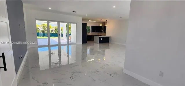 a view of a kitchen with a sink and a window