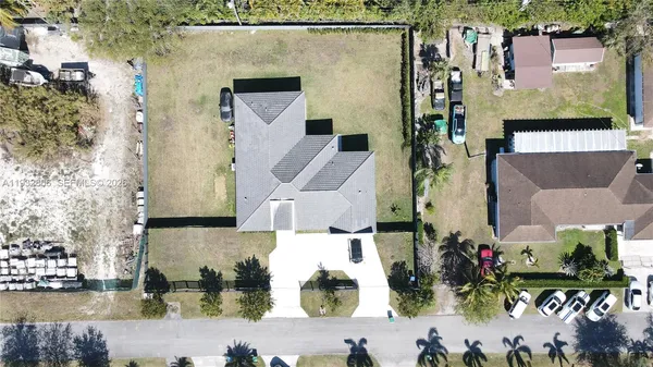 an aerial view of houses with outdoor space