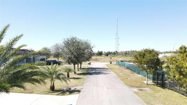 a view of a swimming pool with a yard
