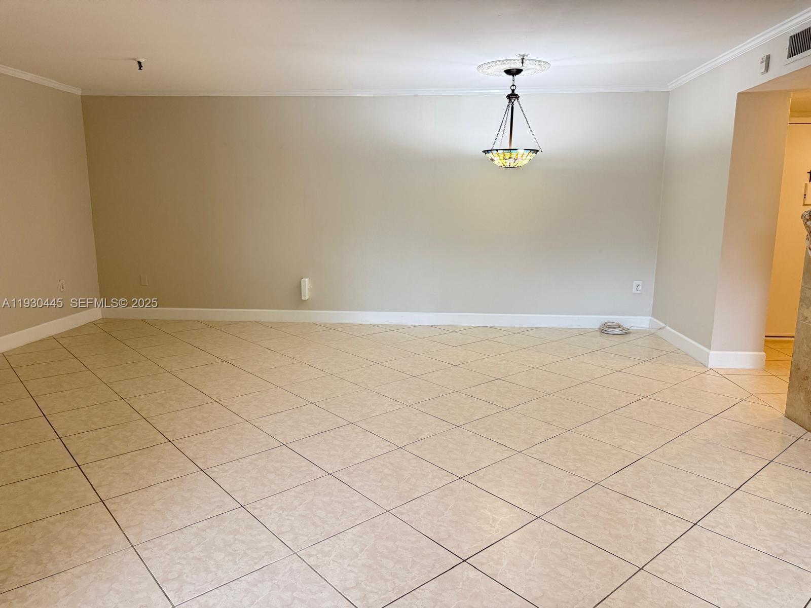 671 Northeast 195th Street, Unit 121E Miami, FL 33179 - Photo 17 of 39 an empty room with table and window