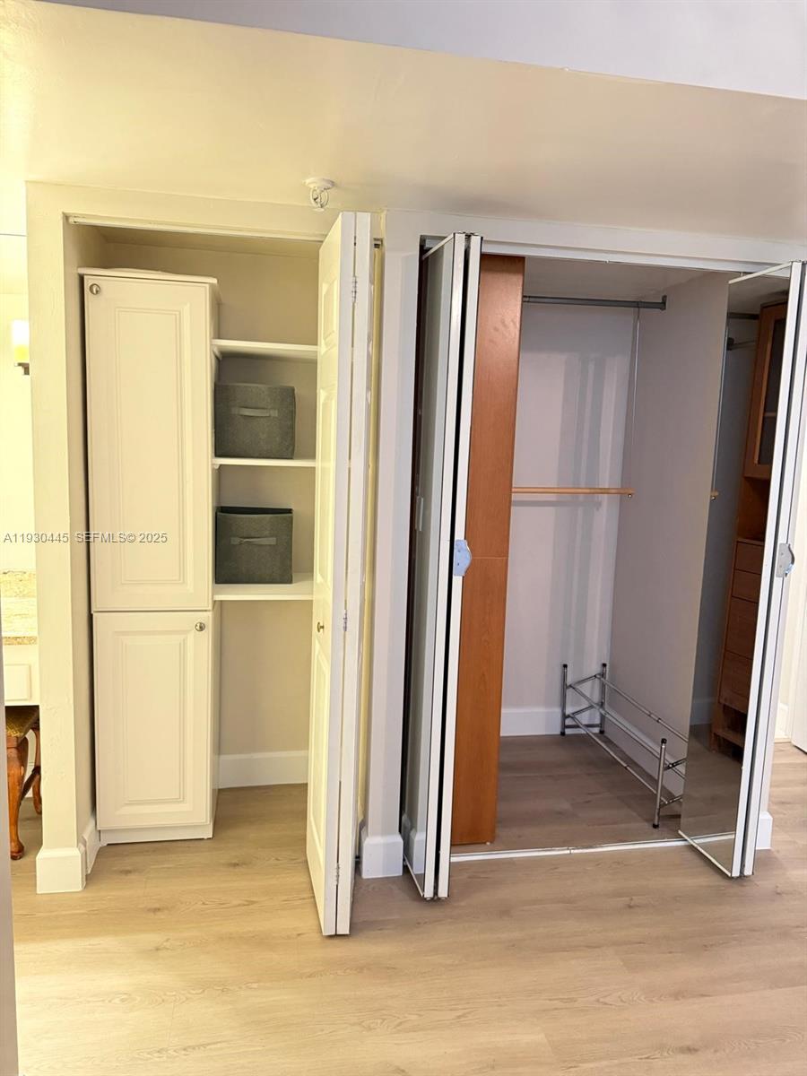 671 Northeast 195th Street, Unit 121E Miami, FL 33179 - Photo 25 of 39 a view of entryway with wooden floor