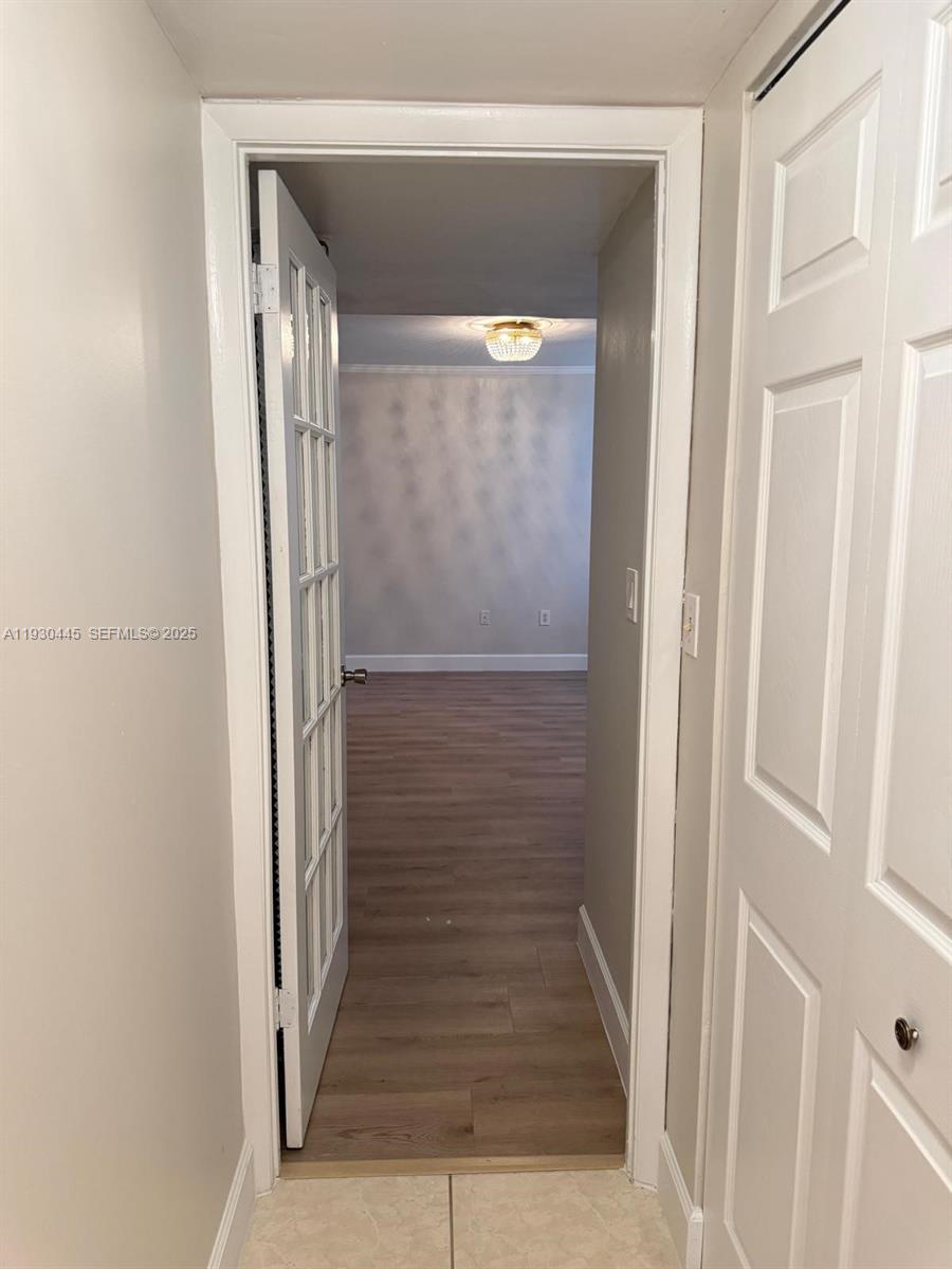 671 Northeast 195th Street, Unit 121E Miami, FL 33179 - Photo 31 of 39 a view of entryway with stairs