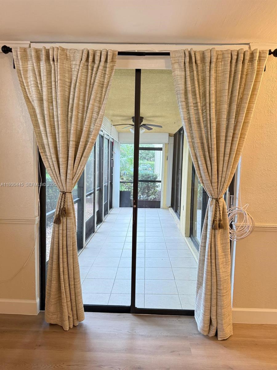 671 Northeast 195th Street, Unit 121E Miami, FL 33179 - Photo 32 of 39 a view of front door and porch