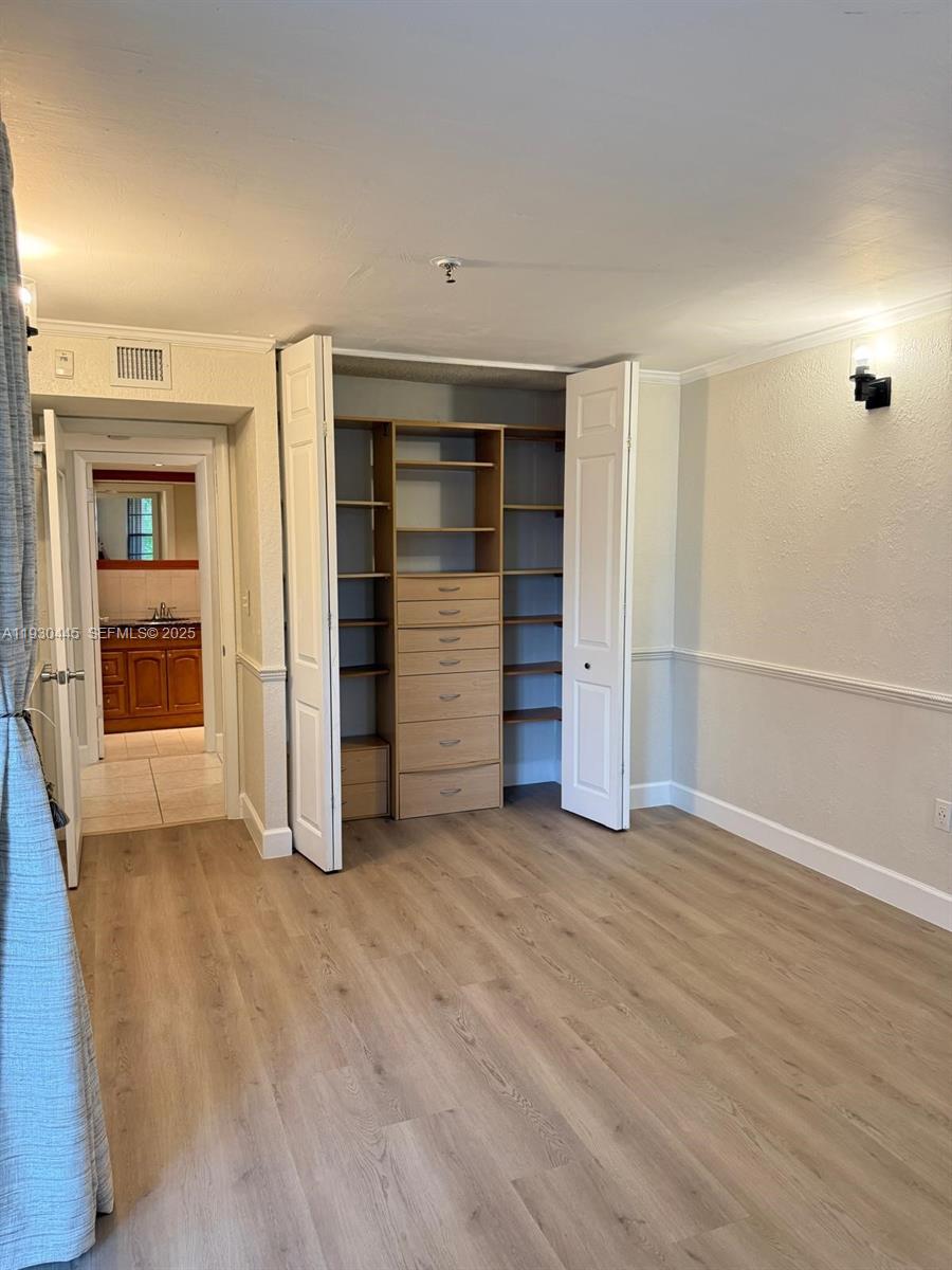 671 Northeast 195th Street, Unit 121E Miami, FL 33179 - Photo 33 of 39 an empty room with closet