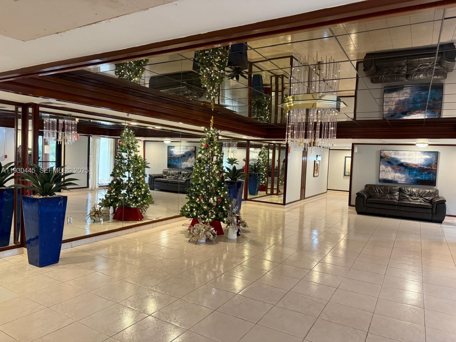 671 Northeast 195th Street, Unit 121E Miami, FL 33179 - Photo 4 of 39 a view of a entryway door of the house
