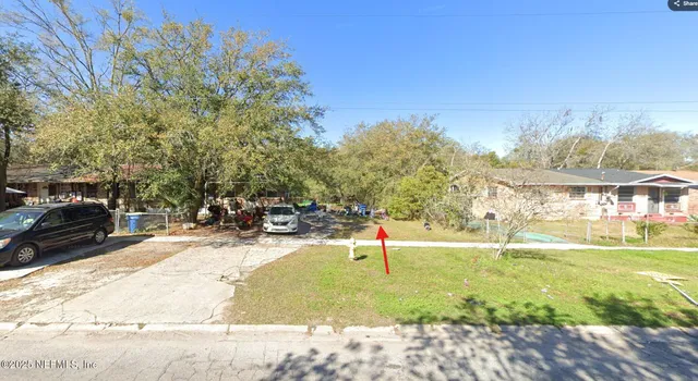 a view of a playground with basketball court