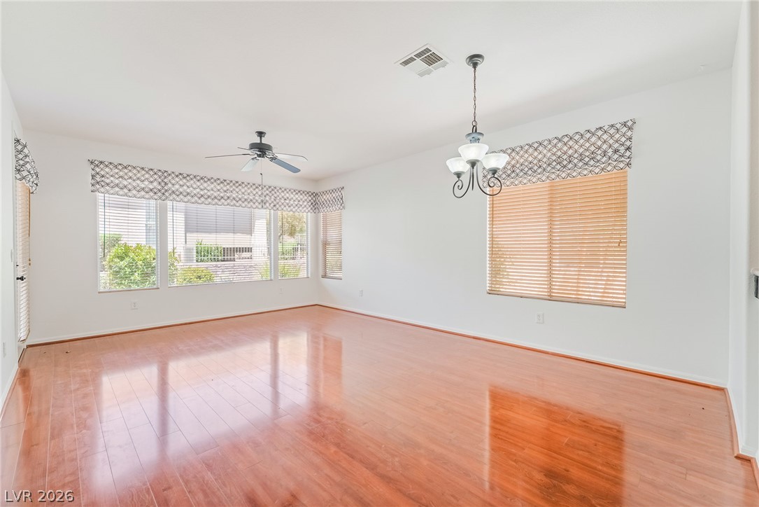 5389 Progresso Street Las Vegas, NV 89135 - Photo 17 of 41 Natural light bathes the gleaming hardwood floors of this inviting living space.
