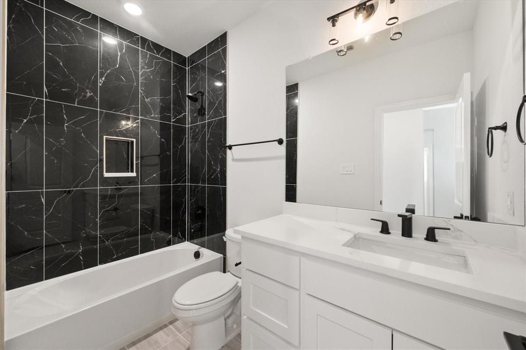 3400 Dobbins Road Corsicana, TX 75110 - Photo 22 of 40 a bathroom with a sink a toilet and shower
