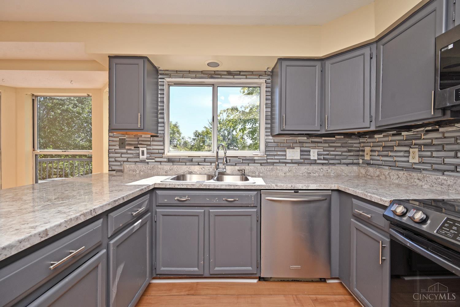 7853 West Chester Road West Chester, OH 45069 - Photo 13 of 54 Neutral kitchen with wood cabinetry.